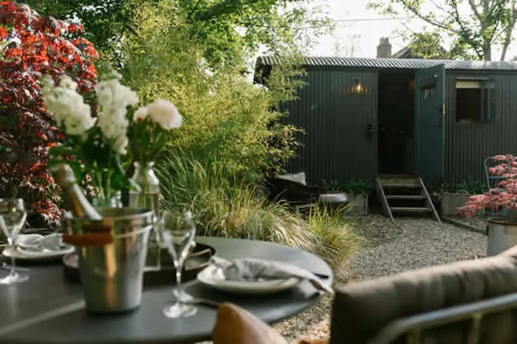 luxury shepherds hut for sale croft garden dining view .webp