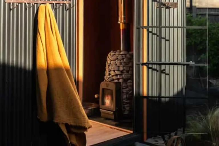 sauna hut door and wood burning stove
