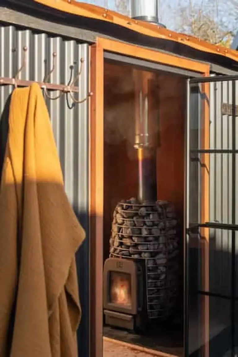 wood fired sauna stove inside sauna hut